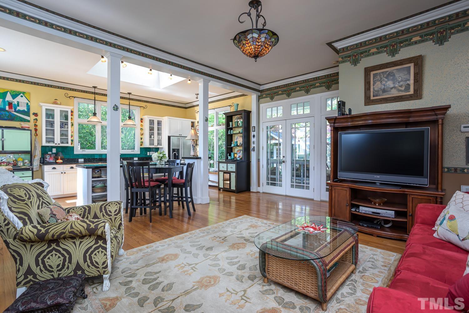 601 Leonidas Court Raleigh, NC 27604 - Photo 18 of 53 a living room with furniture a flat screen tv and a large window