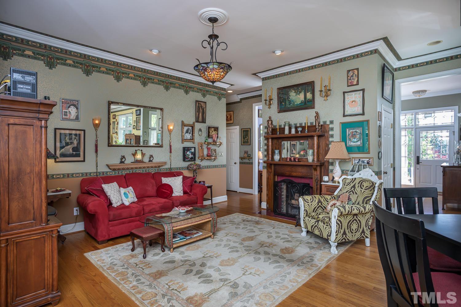 601 Leonidas Court Raleigh, NC 27604 - Photo 19 of 53 a living room with furniture and wooden floor
