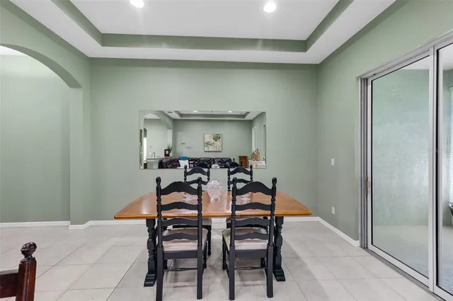 a dining room with furniture and window