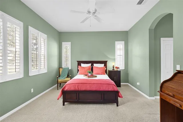 a kitchen with granite countertop wood cabinets and a stove top oven