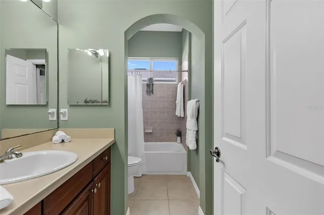 an aerial view of residential houses with outdoor space and river