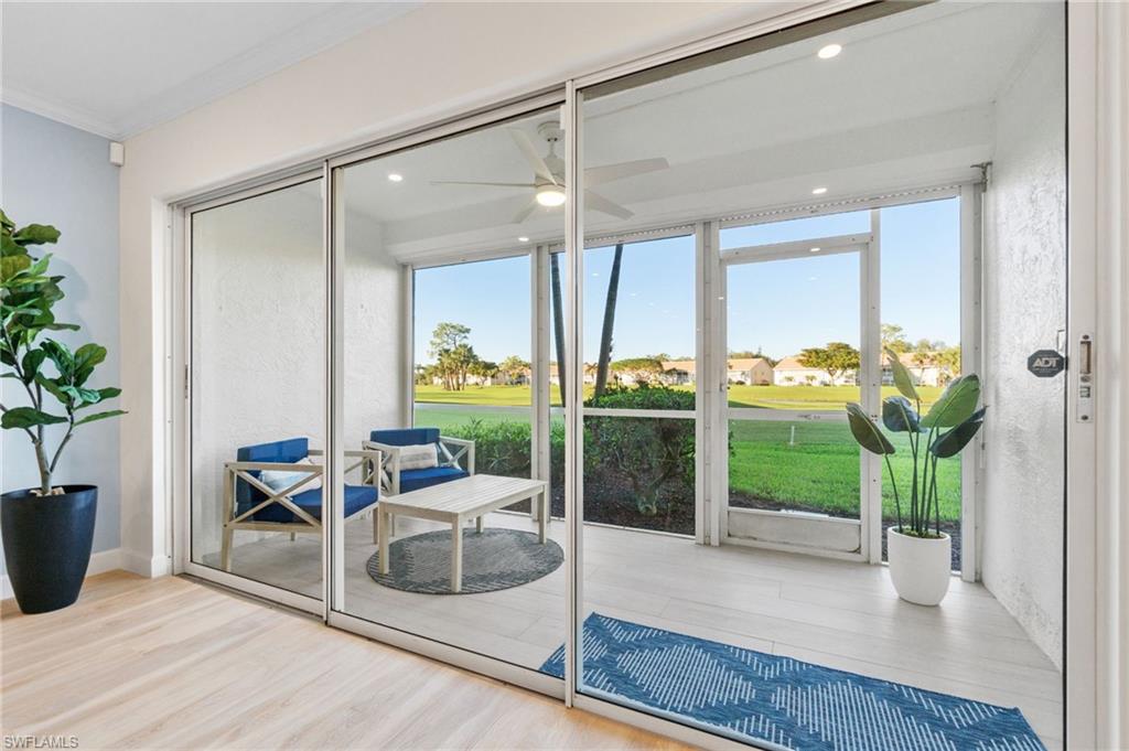 5975 Bloomfield Circle, Unit C108 Naples, FL 34112 - Photo 16 of 50 Walk out Screened in lanai offers expansive golf course views as well as lake vistas. Perfect place for morning coffee or evening relaxation.