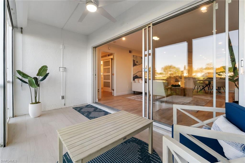 5975 Bloomfield Circle, Unit C108 Naples, FL 34112 - Photo 20 of 50 Sunroom with ceiling fan