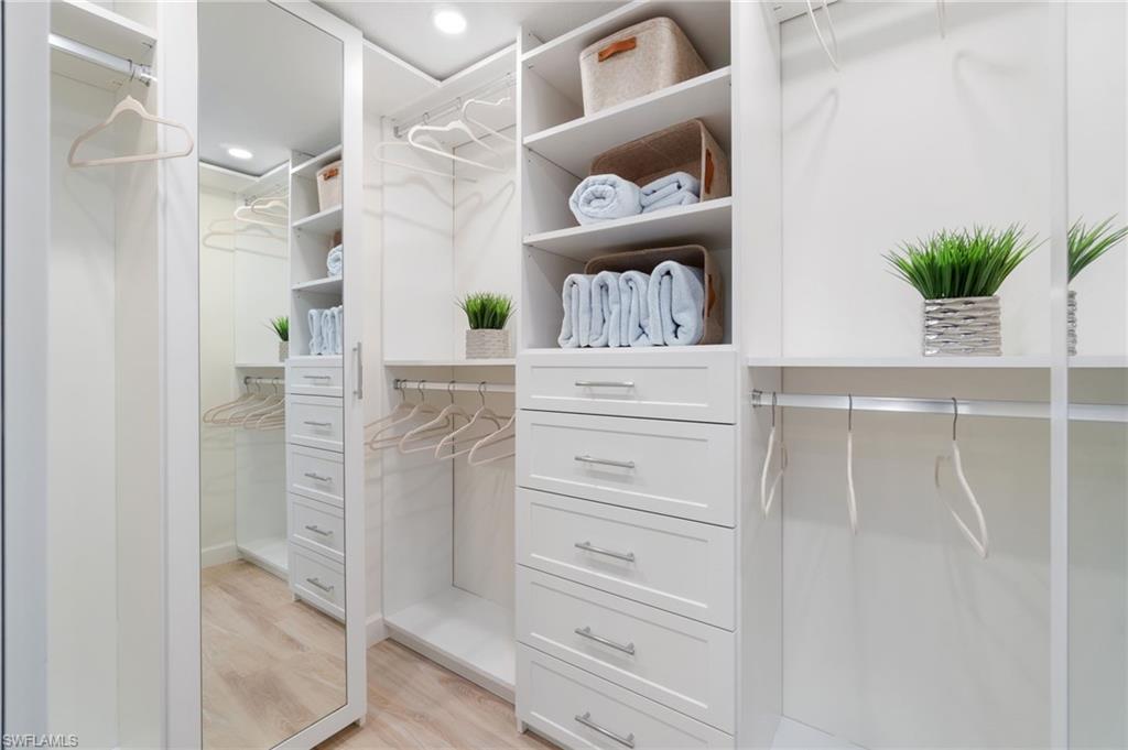 5975 Bloomfield Circle, Unit C108 Naples, FL 34112 - Photo 30 of 50 Custom primary walk-in closet