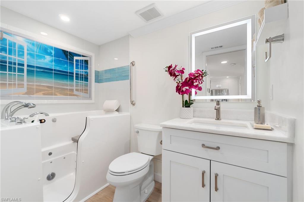 5975 Bloomfield Circle, Unit C108 Naples, FL 34112 - Photo 35 of 50 Guest bath offers a SPECTACULAR therapeutic tub with chromotherapy and jets!! A $14k upgrade!