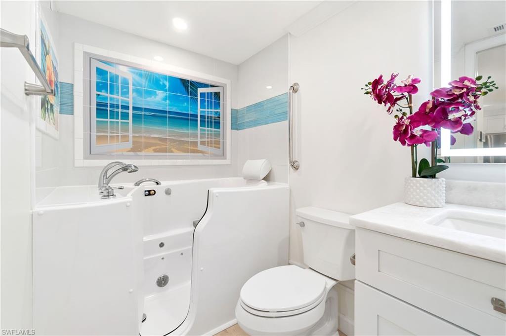 5975 Bloomfield Circle, Unit C108 Naples, FL 34112 - Photo 36 of 50 Therapeutic WALK-IN tub with chromotherapy and jets!! A $14k upgrade!