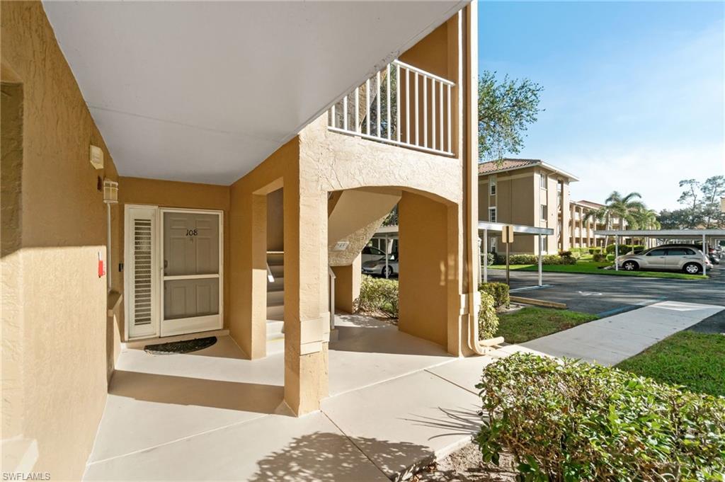 5975 Bloomfield Circle, Unit C108 Naples, FL 34112 - Photo 39 of 50 Entrance to property featuring a balcony