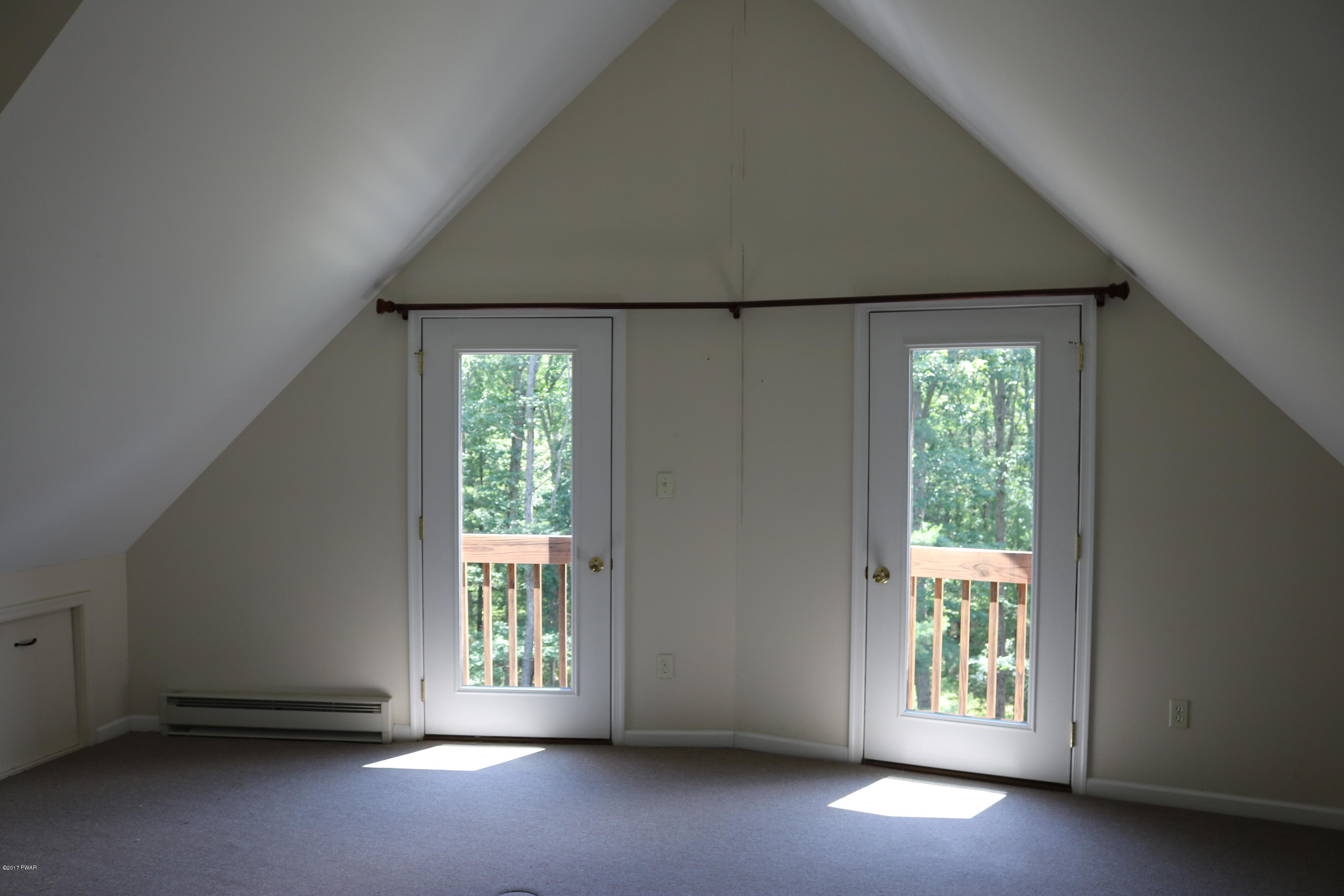 181 Butternut Road Milford, PA 18337 - Photo 10 of 26 a view of an empty room with a window