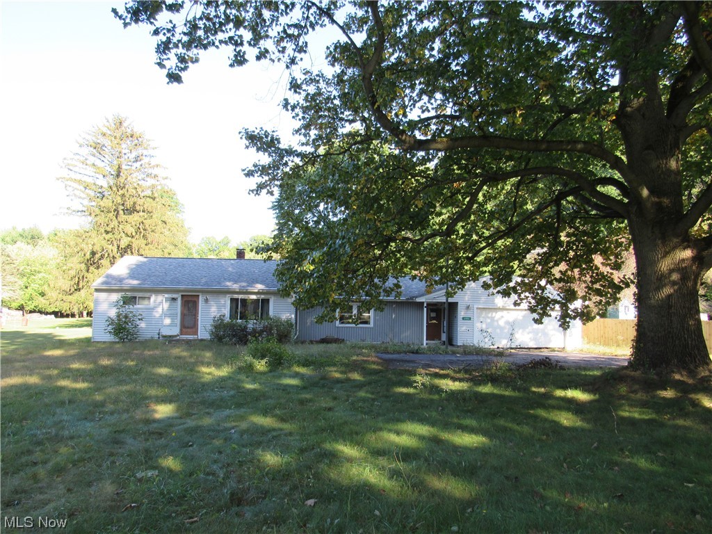 6986 Reed Road Conneaut, OH 44030 - Photo 2 of 22 View of front of property featuring a front yard