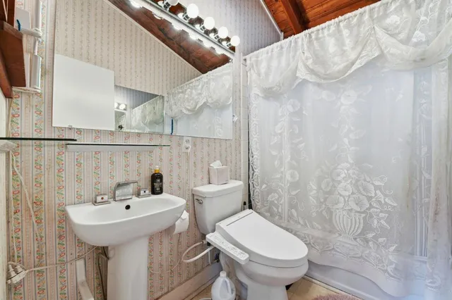 a room with a cabinets and a window