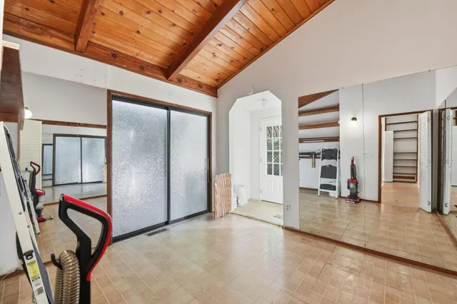 a view of a house with backyard and deck
