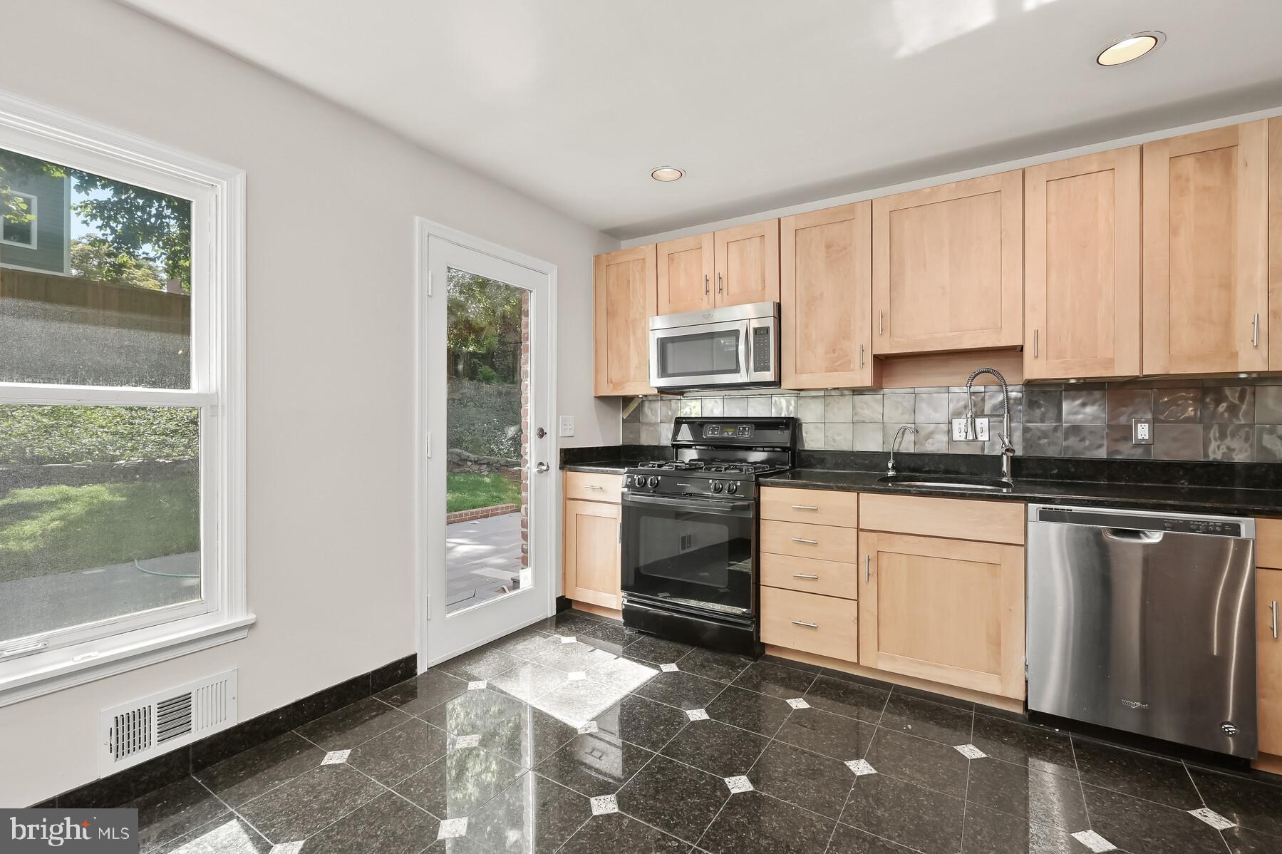 7701 Sebago Road Bethesda, MD 20817 - Photo 2 of 50 Updated kitchen with exit to rear yard and deck