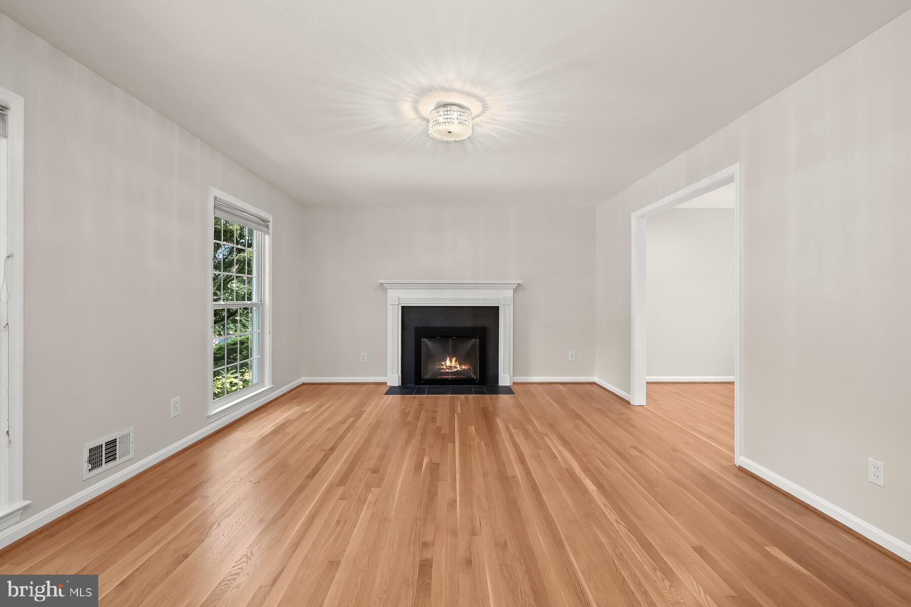 7701 Sebago Road Bethesda, MD 20817 - Photo 5 of 50 Living room with newly refinished hardwood floors