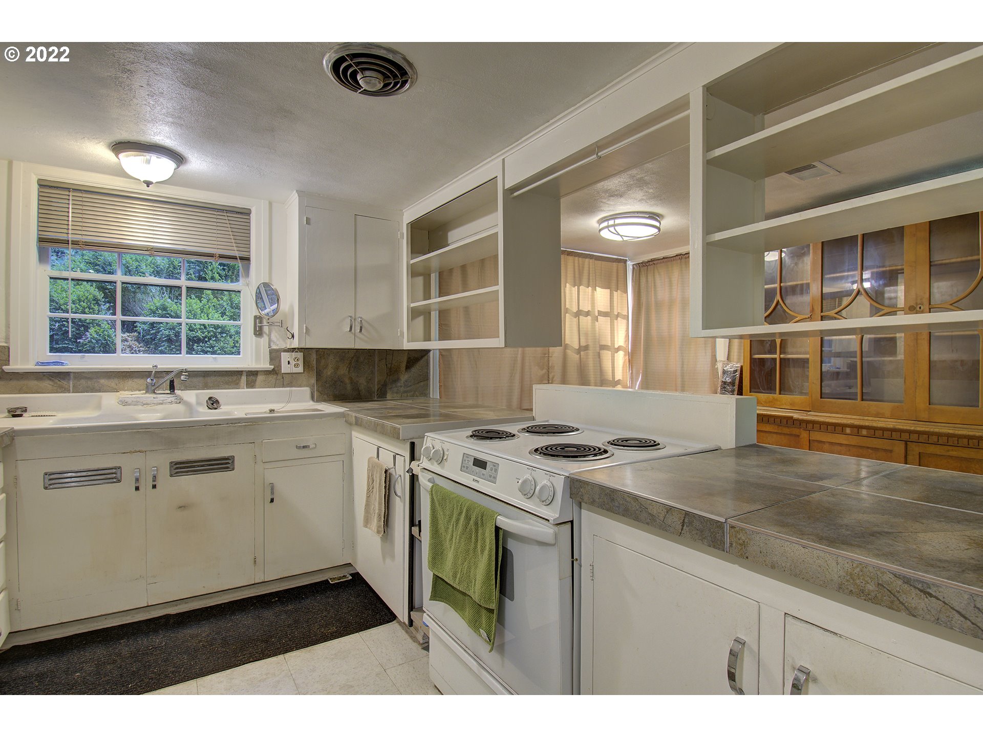1110 Southeast Littlepage Road Corbett, OR 97019 - Photo 16 of 31 a kitchen with a stove and a sink