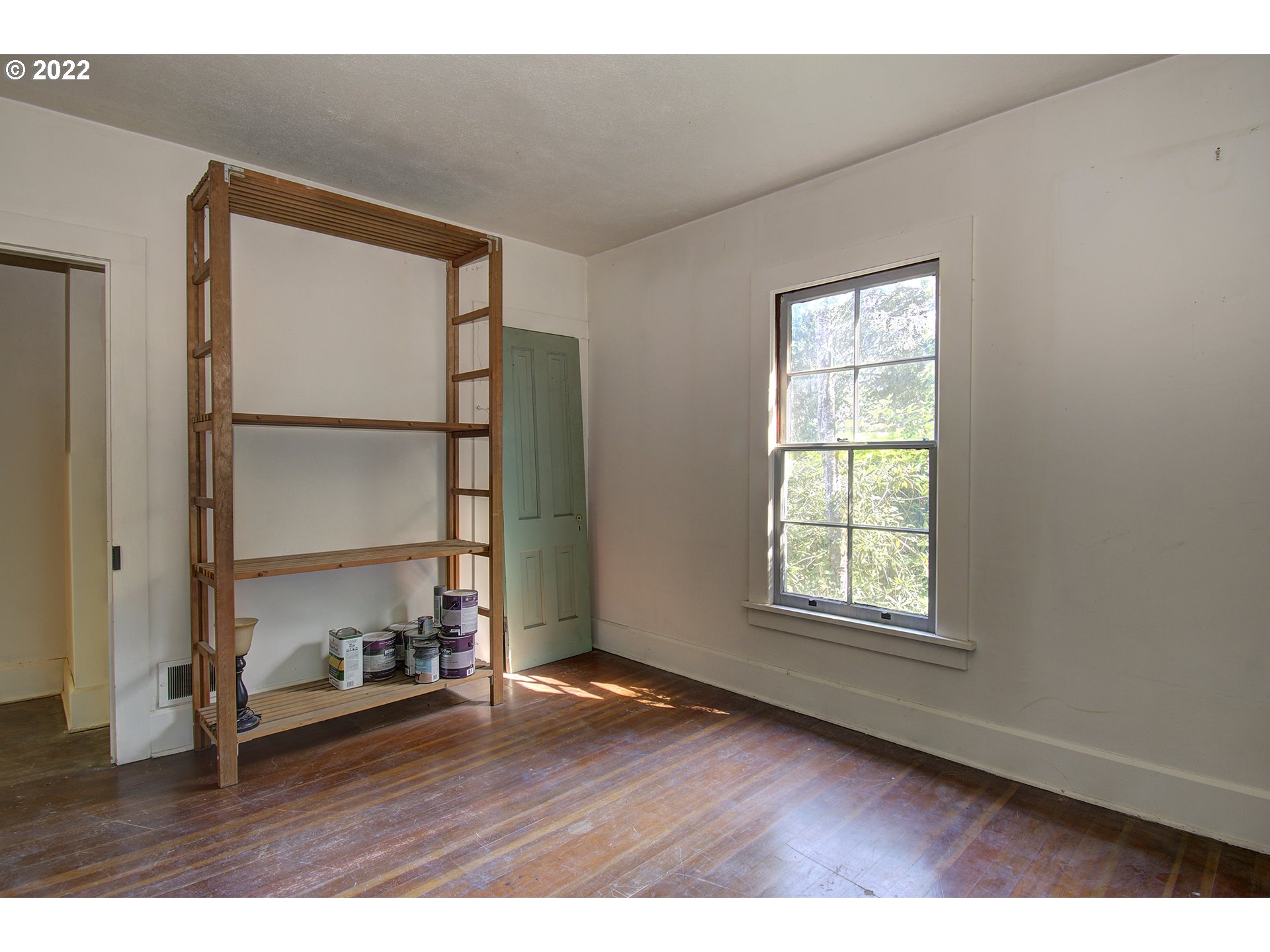 1110 Southeast Littlepage Road Corbett, OR 97019 - Photo 21 of 31 an empty room with wooden floor and windows
