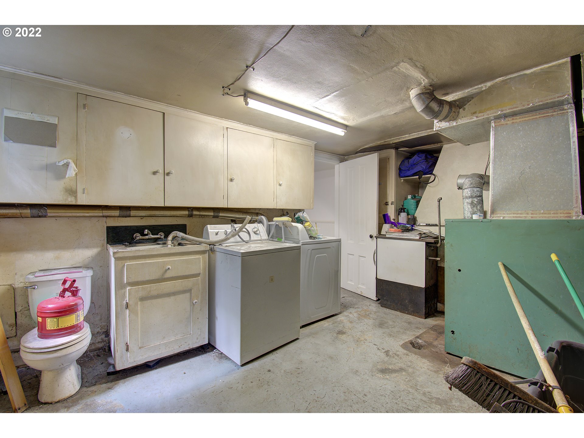 1110 Southeast Littlepage Road Corbett, OR 97019 - Photo 27 of 31 a utility room with cabinets washer and dryer