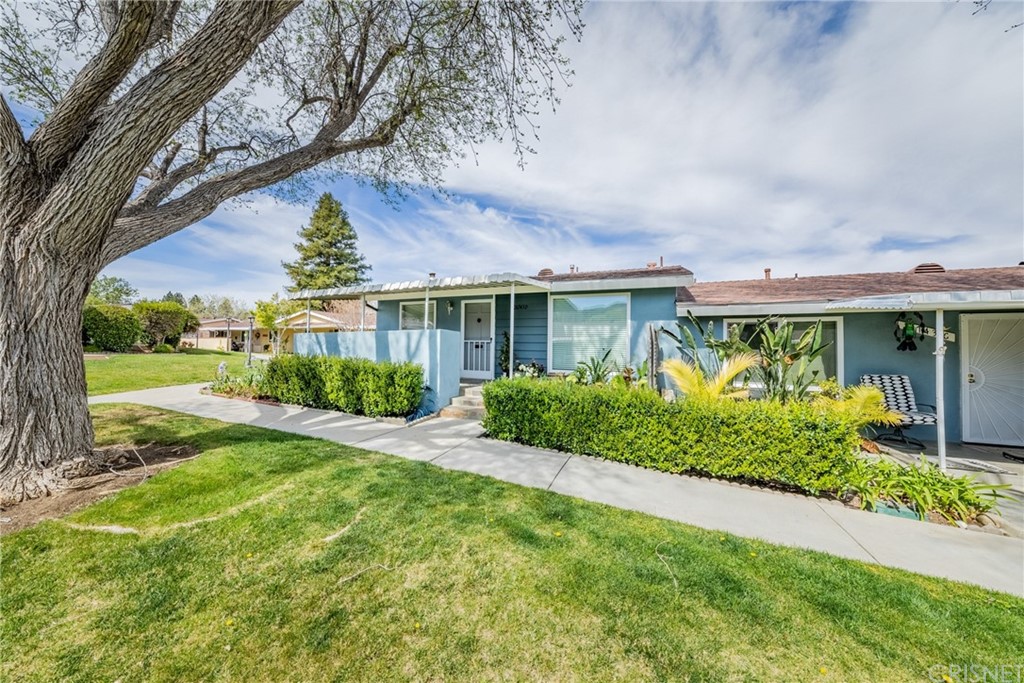 26743 Oak Crossing Road, Unit D Newhall, CA 91321 - Photo 1 of 1 a view of a house with garden and plants