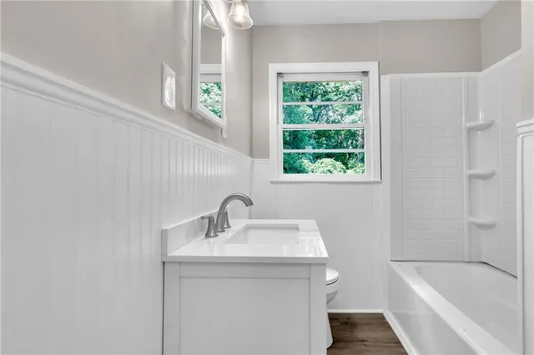 a bathroom with a sink and a bathtub