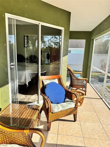 a view of sitting area with furniture and front door