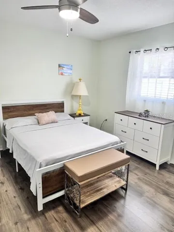 a bedroom with a bed and a dresser
