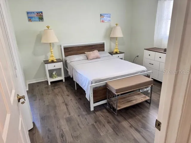 a bed room with a bed and a window