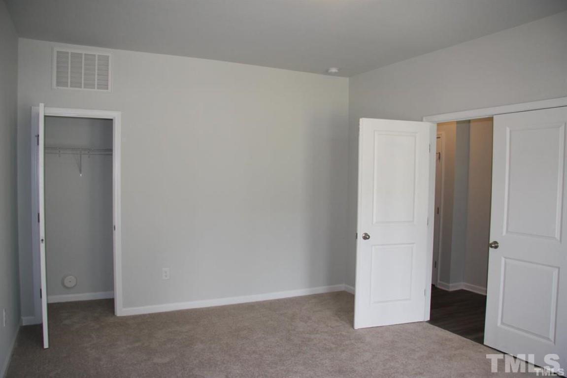 2919 Sunflower Road Apex, NC 27502 - Photo 7 of 34 an empty room with closet area