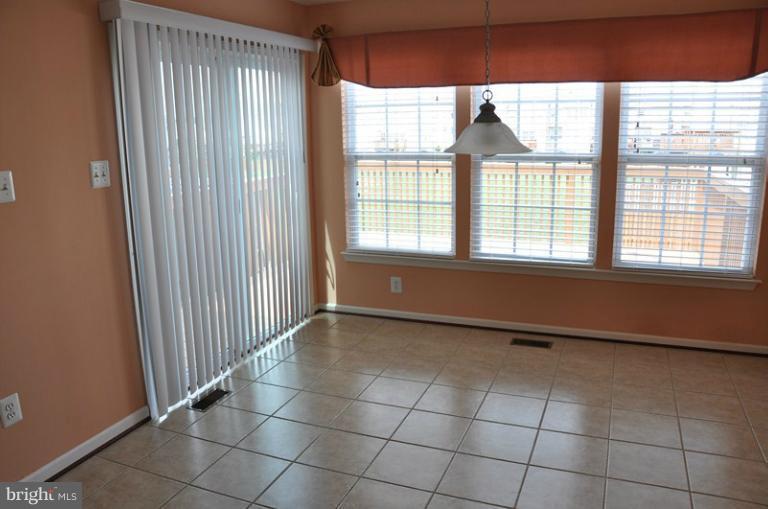 9744 Biggs Road Baltimore, MD 21220 - Photo 5 of 30 a view of an empty room with a window
