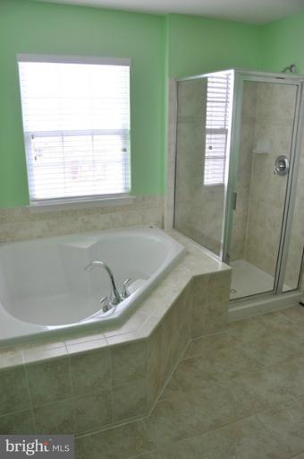 9744 Biggs Road Baltimore, MD 21220 - Photo 9 of 30 a bath tub sitting next to a window