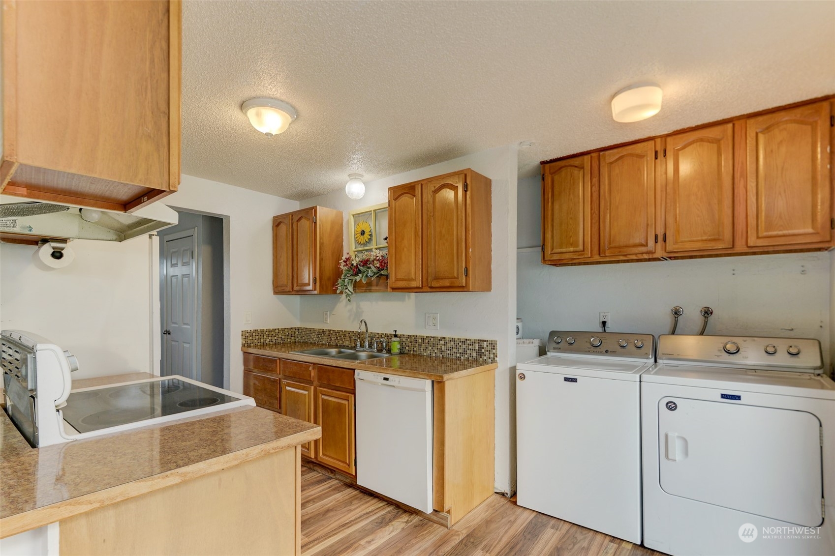 6721 183rd Avenue Southwest Rochester, WA 98579 - Photo 6 of 18 a room with a sink cabinets and utility