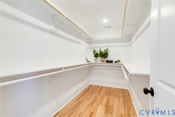 a bathroom with double vanity sink and a mirror