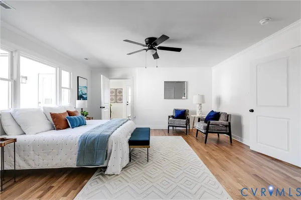 a living room with furniture a rug and a window