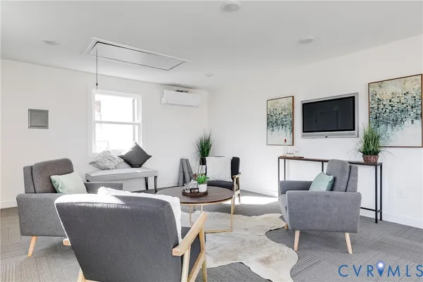 a living room with furniture and a table
