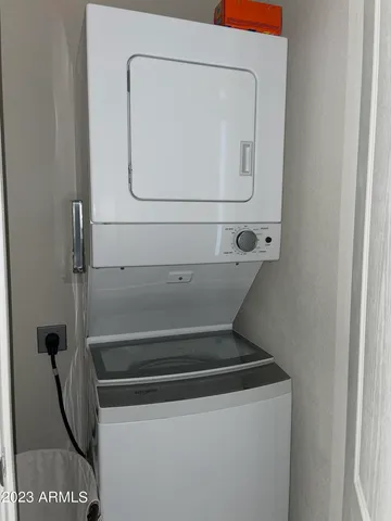 a view of a livingroom with a furniture and chandelier fan