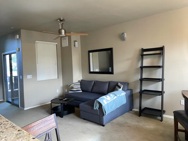 a kitchen with stainless steel appliances kitchen island granite countertop a refrigerator and a stove top oven