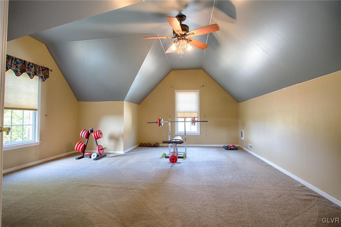 724 South Delps Road Bath, PA 18014 - Photo 13 of 23 an empty room with stairs and chandelier fan