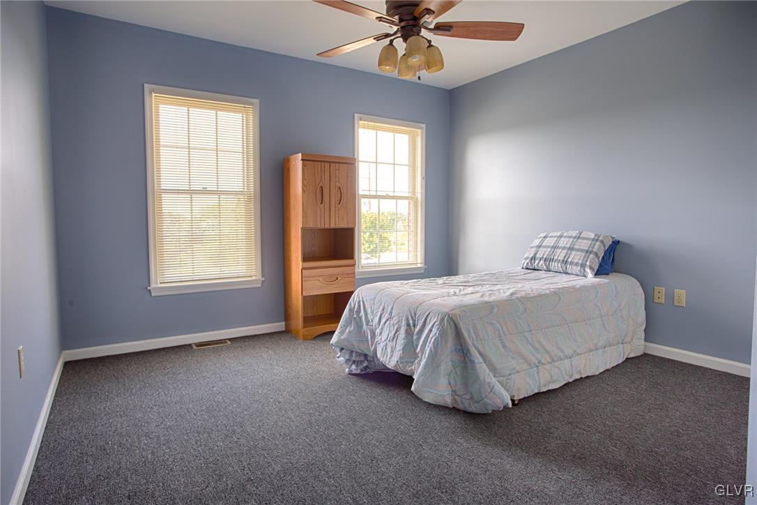 724 South Delps Road Bath, PA 18014 - Photo 17 of 23 a spacious bedroom with a bed and a window