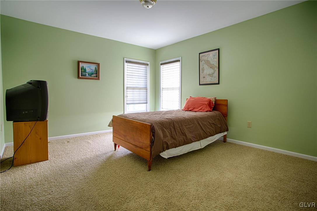 724 South Delps Road Bath, PA 18014 - Photo 18 of 23 a bedroom with a bed and painting on the wall