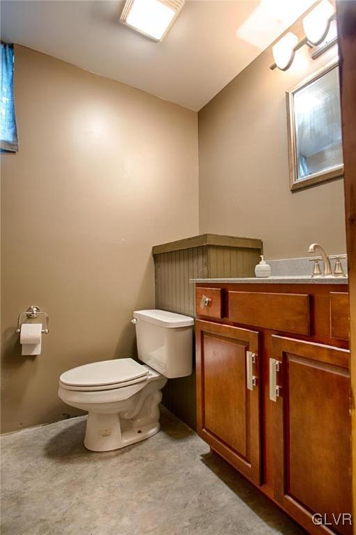 724 South Delps Road Bath, PA 18014 - Photo 19 of 23 a bathroom with a sink a toilet and a mirror