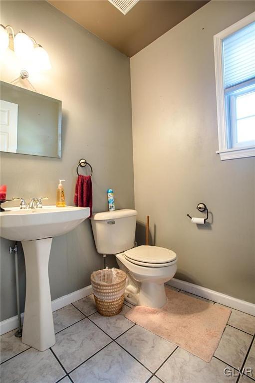 724 South Delps Road Bath, PA 18014 - Photo 21 of 23 a bathroom with a toilet sink and mirror