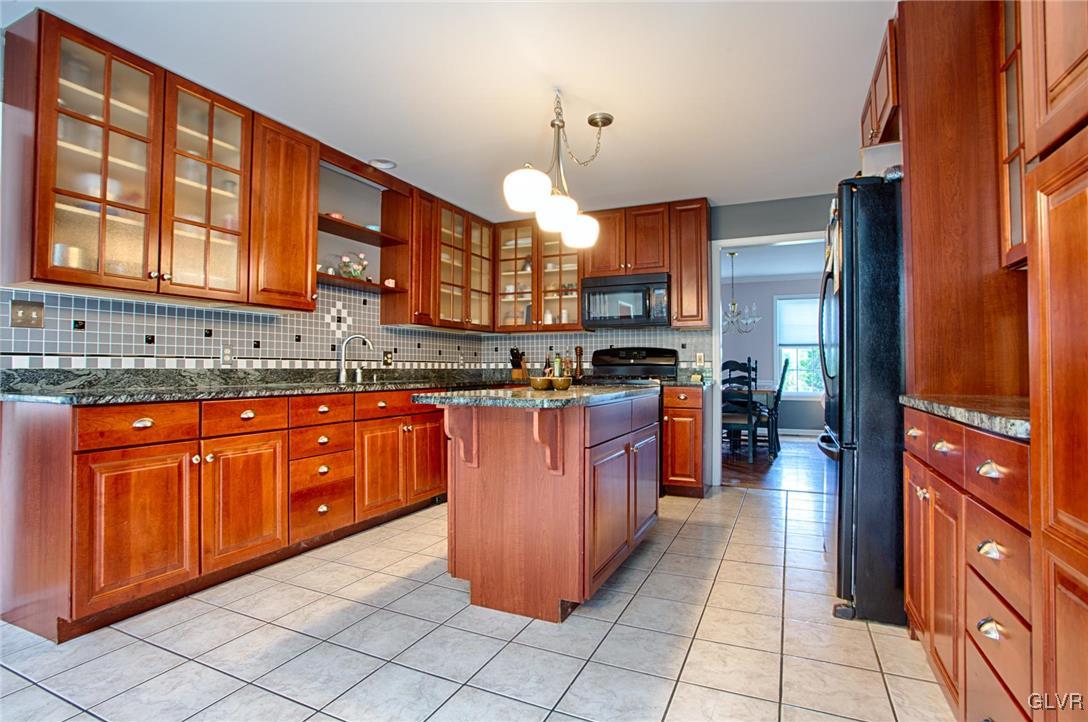 724 South Delps Road Bath, PA 18014 - Photo 5 of 23 a kitchen with stainless steel appliances granite countertop a stove a sink dishwasher and a refrigerator