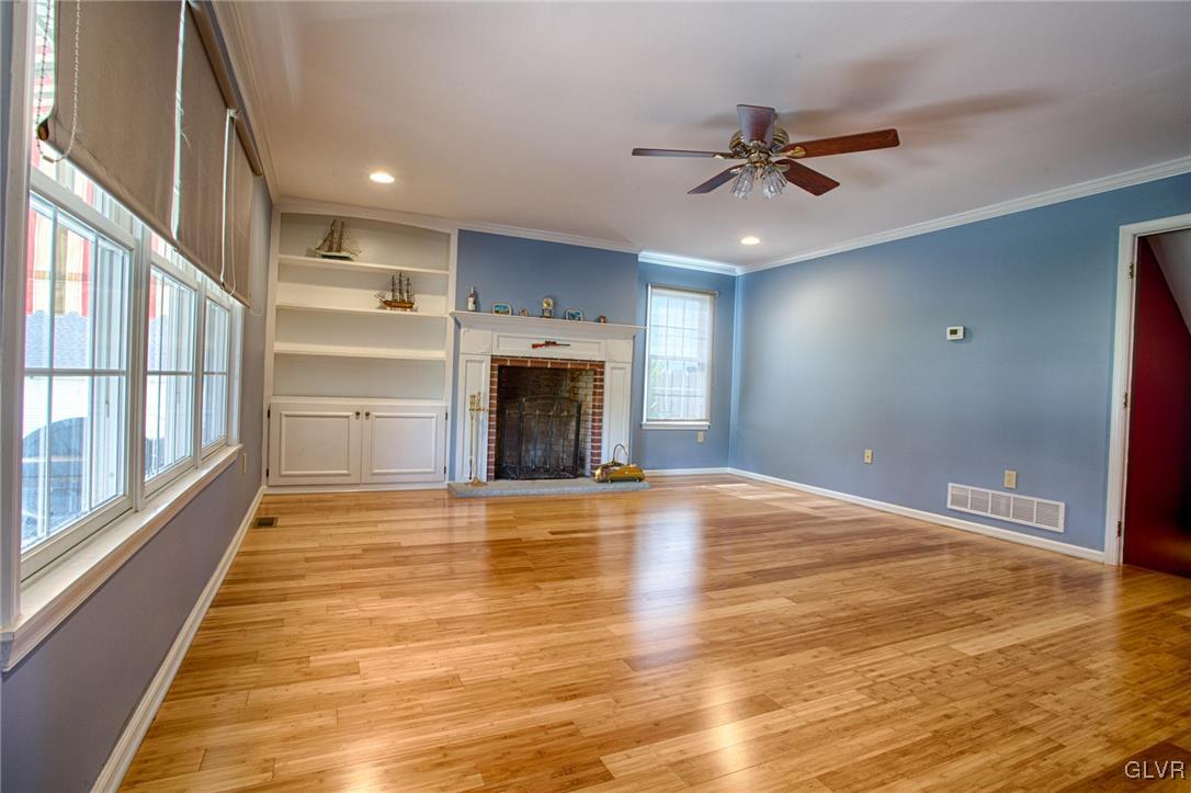 724 South Delps Road Bath, PA 18014 - Photo 8 of 23 a view of an empty room with a fireplace and a window