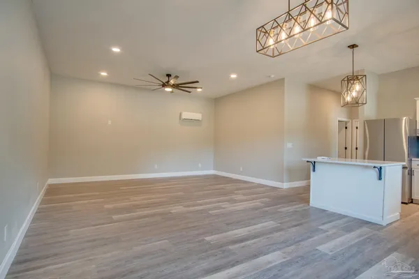 a view of a kitchen with a dishwasher and wooden floor