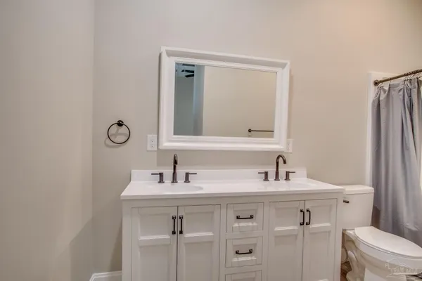 a bathroom with a shower and a toilet