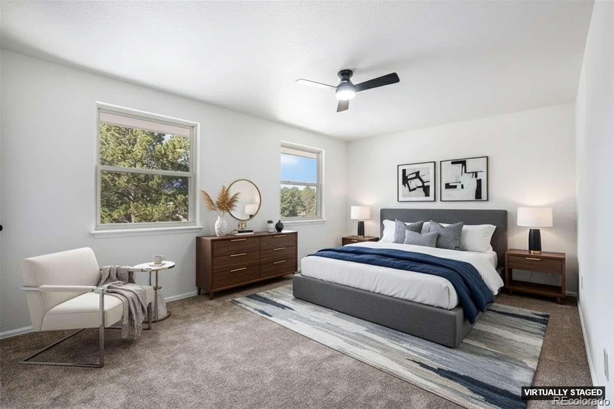 6075 Castlewood Lane Colorado Springs, CO 80918 - Photo 12 of 23 a bedroom with a bed and a window