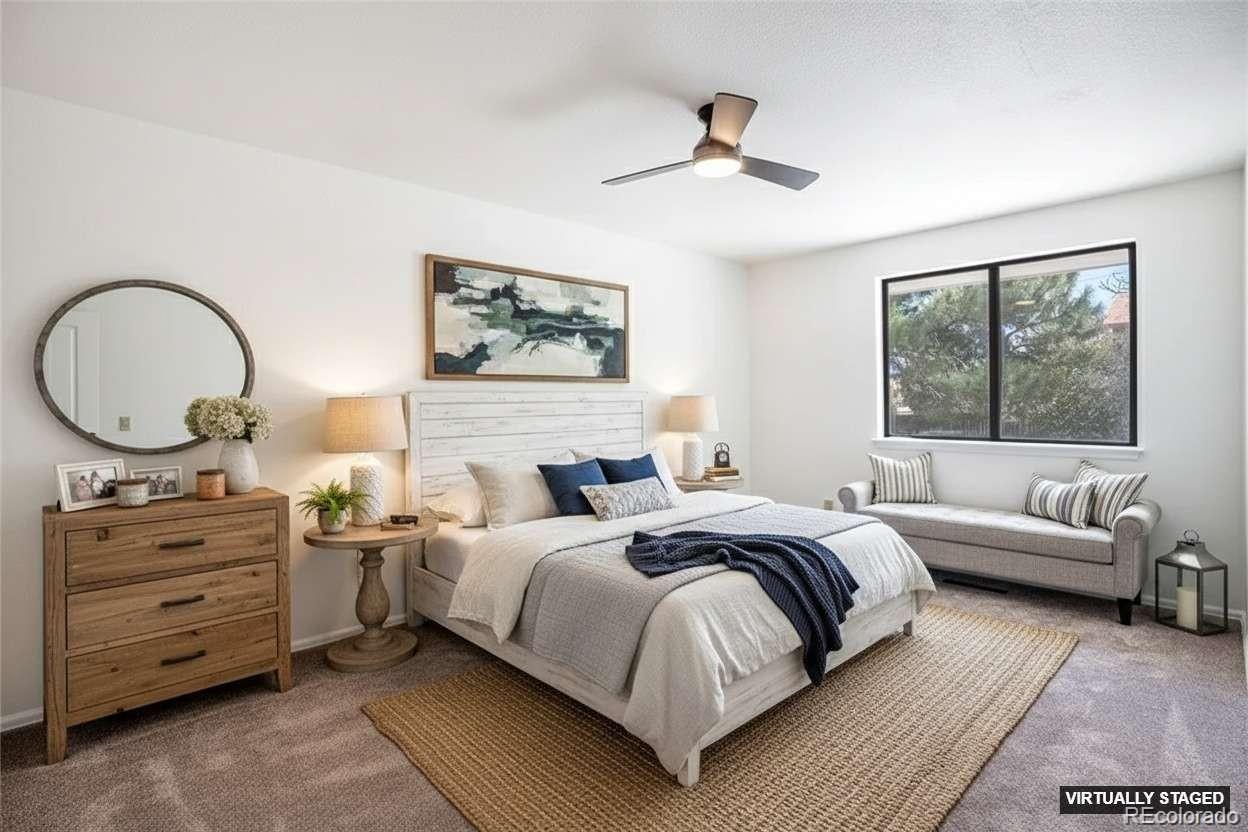 6075 Castlewood Lane Colorado Springs, CO 80918 - Photo 15 of 23 a bedroom with a bed a couch and dresser