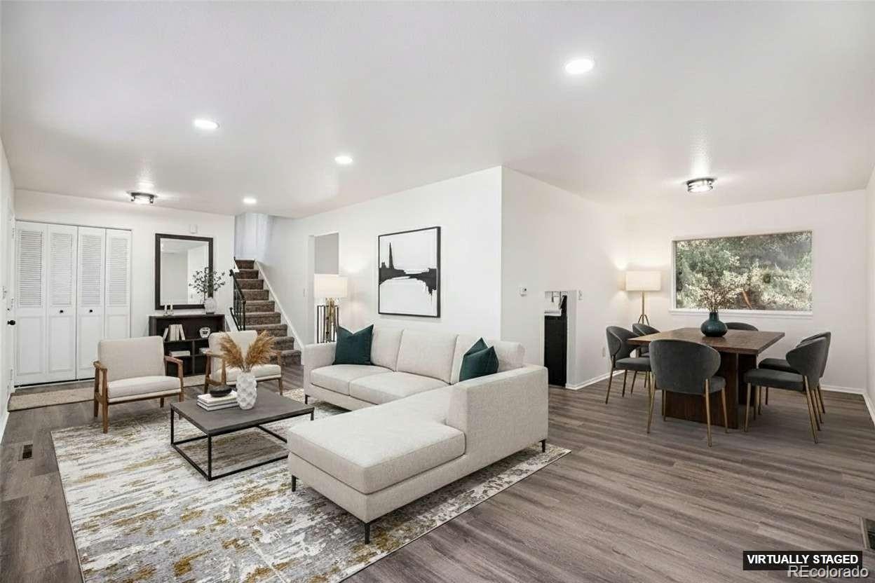 6075 Castlewood Lane Colorado Springs, CO 80918 - Photo 4 of 23 a living room with furniture wooden floor and a window