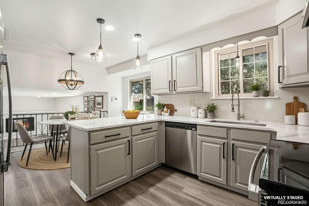 6075 Castlewood Lane Colorado Springs, CO 80918 - Photo 5 of 23 a kitchen with a sink stove and cabinets