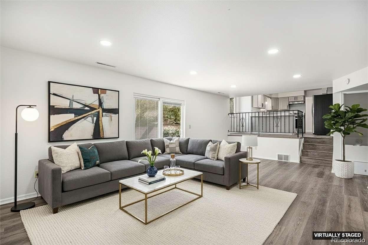 6075 Castlewood Lane Colorado Springs, CO 80918 - Photo 7 of 23 a living room with furniture and a large window