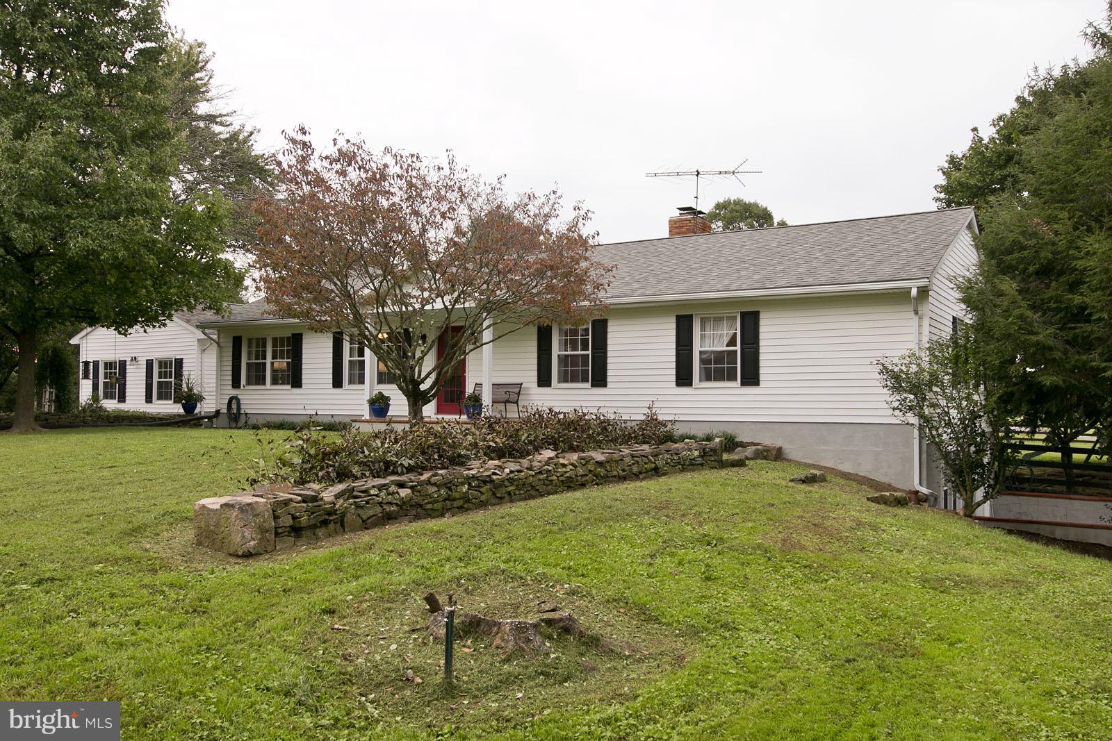 2360 Hunting Ridge Road Winchester, VA 22603 - Photo 1 of 30 a front view of a house with a yard