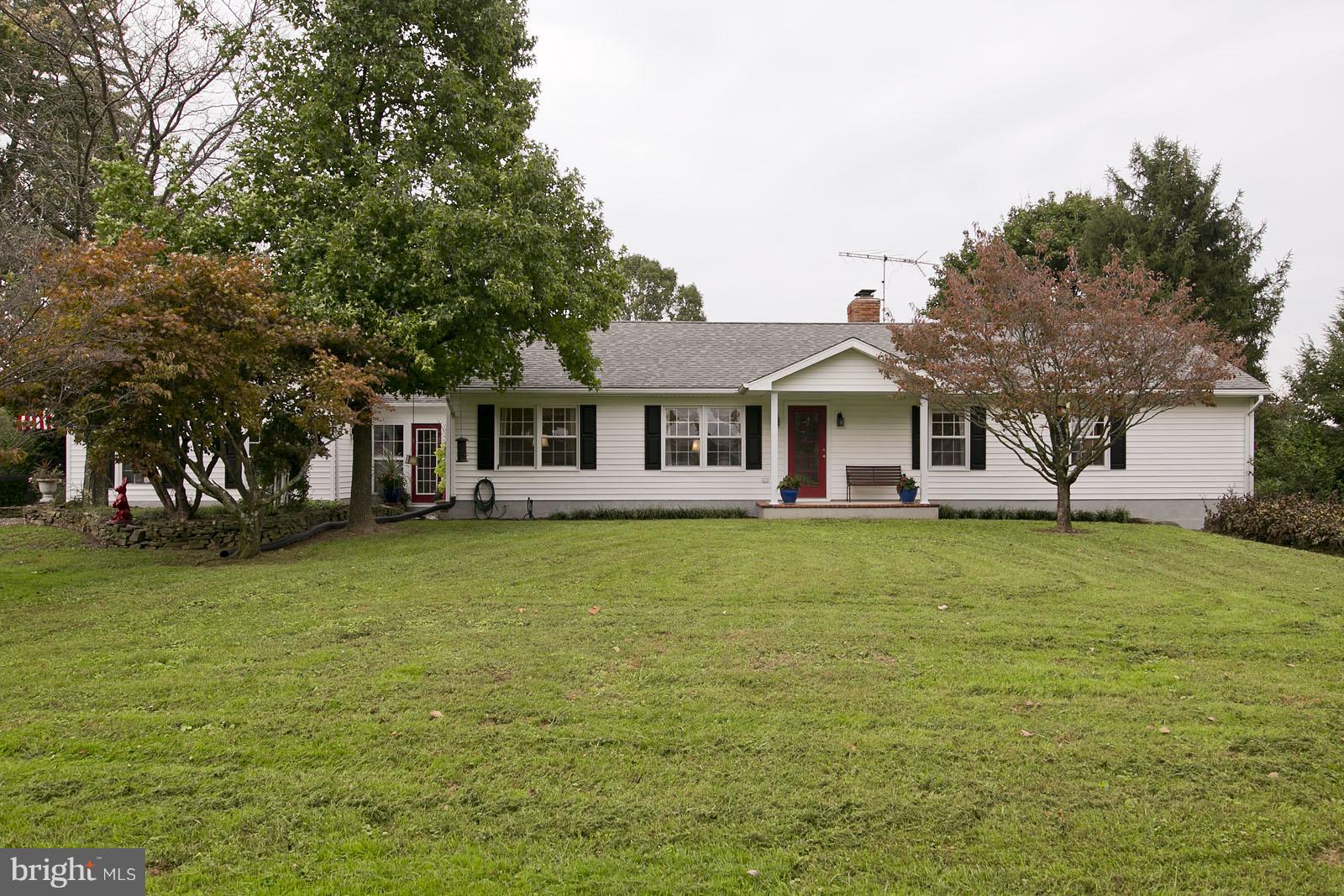 2360 Hunting Ridge Road Winchester, VA 22603 - Photo 2 of 30 a front view of a house with a garden